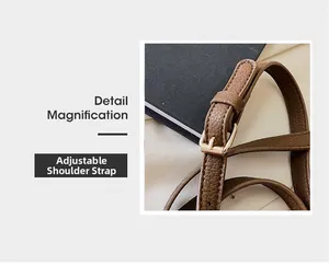 Detail magnification of brown lychee grain leather adjustable strap with gold metal buckle