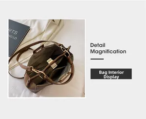 Internal structure of brown leather tote showing three compartments and gold zipper detail