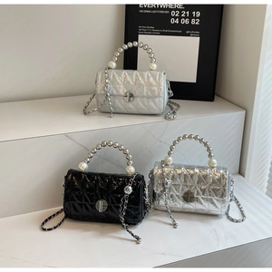 Three quilted bags featuring pearl bead handles and chain straps in assorted metallic finishes