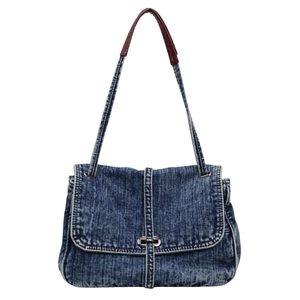 Retro denim tote bag in washed blue with leather handle and secure metal clasp