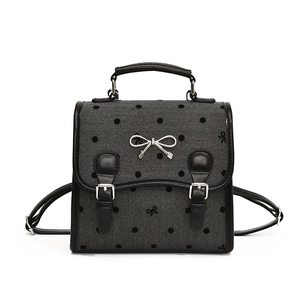 Chic grey herringbone backpack with black polka dots and silver bow hardware detail