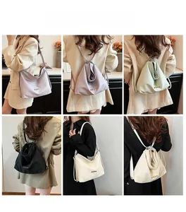 Showcasing four colors of woven texture drawstring backpacks with heart-shaped metal accents