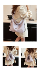 Detail of light purple woven backpack with silver heart accents in a modern office setting