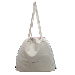 Chic cream canvas drawstring crossbody bag with blue My Sunday print and pink lining