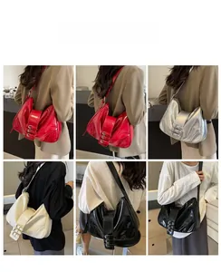 Detail of patent leather shoulder bags with triple metal buckles in multiple colors