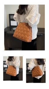Detailed views of brown quilted tote bag with gold chain strap worn by a model