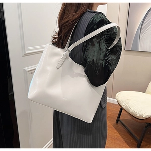 Elegant minimalist white large capacity tote bag shown as a stylish underarm shoulder bag