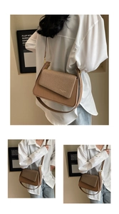 Détail du mélange de cuir minimaliste et de texture tissée sur le sac à bandoulière chic