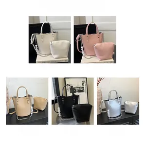 Detail view of large bucket bag set with chain and pearl strap in five various colors