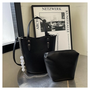 Detail of black lychee grain bucket bag with beaded chain and matching coin purse