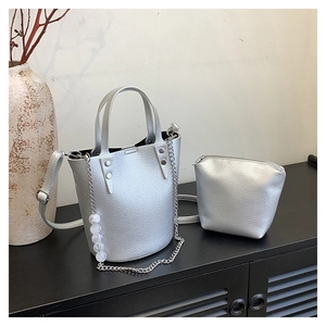 Silver lychee grain leather bucket bag with chain detail and matching coin purse