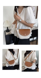 Detail view of woven shoulder bag featuring brown leather flap and metal rivet studs