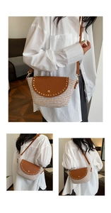 Detail of bohemian straw crossbody bag with brown leather flap and gold stud accents