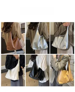 Macro detail of high-capacity tote bags showing five colors and adjustable straps