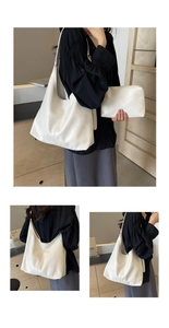 Close-up of white tote bag set featuring wrinkled texture finish and matching pouch