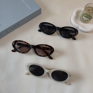 Retro oval sunglasses in black, tortoise, and cream with UV400 protection for women