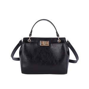 Classic black glossy faux leather handbag with gold twist lock and elegant handle