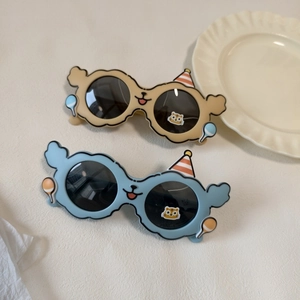 Detail of cartoon party sunglasses for kids with cloud frames and bear ear accents