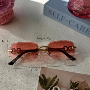 Frameless rimless gradient sunglasses with carved wavy lens edges and gold metal frame