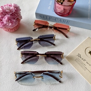 Retro rimless geometric sunglasses with tinted lenses in blue, purple, and orange gradients