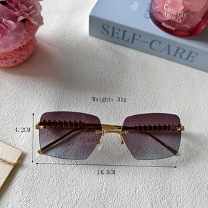 Frameless cat-eye sunglasses with purple gradient lenses and textured gold metal temples