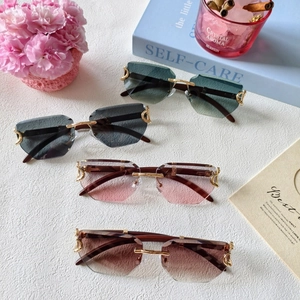 Frameless geometric sunglasses in gradient tints with gold metal bridge on stylish background