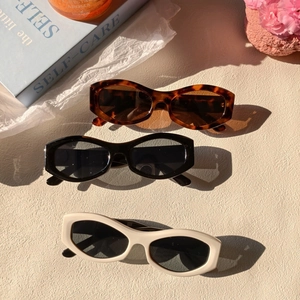 Retro oval sunglasses in tortoiseshell, black, and cream white for women and men