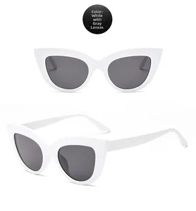 Detailed front and side view of trendy white cat eye sunglasses with grey lenses