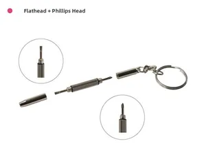 Macro detail of portable mini 3-in-1 screwdriver keychain with flat and cross head bits