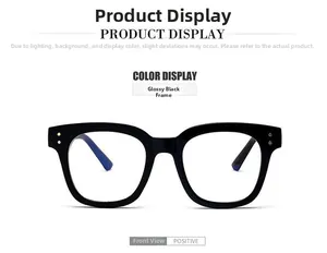 Vue de face de lunettes noires oversize classiques avec rivets dorés sur fond blanc neutre
