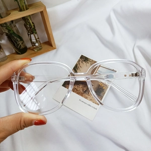 Close-up of retro oversized clear frame sunglasses with Z3334 model detail on temple