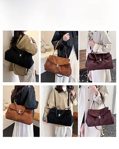 Detail view of versatile suede shoulder bags with metal twist locks in various colors