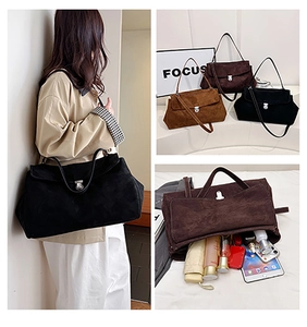 Macro detail of spacious interior and buckle on faux suede crossbody shoulder bag