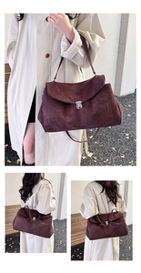 Detail of burgundy suede tote bag with metal clasp and large capacity for commuting
