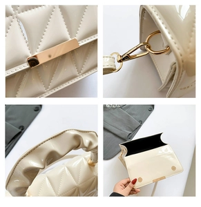 Détails du sac en cuir verni crème avec surpiqûres en losanges et finitions dorées