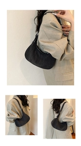 Detailed views of a black denim half-moon underarm bag with adjustable shoulder strap
