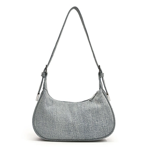 Light blue denim hobo shoulder bag with crescent moon shape and adjustable silver buckle strap