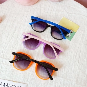 Three pairs of colorful children's sunglasses with gradient lenses and UV protection