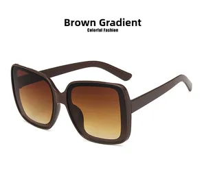 Detail view of brown gradient lenses and square frame of fashionable oversized sunglasses