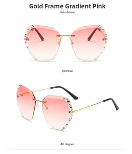 Detail of rimless gold frames with pink gradient lenses and colorful rhinestone accents
