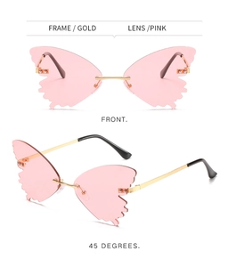Detail of butterfly shaped rimless sunglasses with pink lenses and gold metal temples