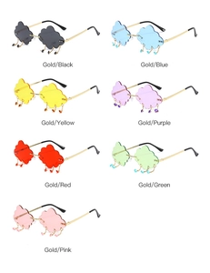 Flat lay of frameless cloud sunglasses with raindrop charms in seven various colors