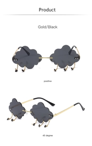 Detail of cloud-shaped rimless sunglasses with dangling metal raindrop charms
