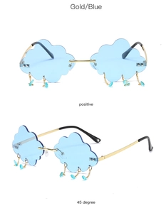 Detail of rimless cloud sunglasses with blue lenses and dangling waterdrop charms