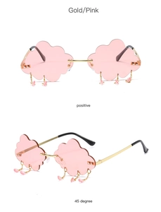 Detail of pink cloud-shaped sunglasses with gold chain and hanging raindrop charms
