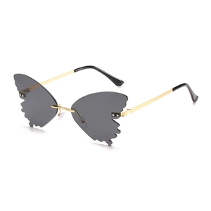 Chic butterfly rimless sunglasses with gold metal frame and dark grey ocean lenses
