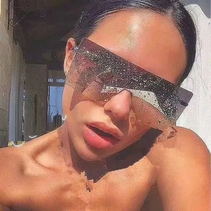 Detail of rimless square sunglasses with gradient lenses and textured water droplet surface