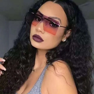 Close-up of frameless square sunglasses with purple-orange gradient lenses and metal arms