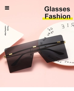 Detail of oversized rimless square sunglasses with gradient lenses and gold metal accents