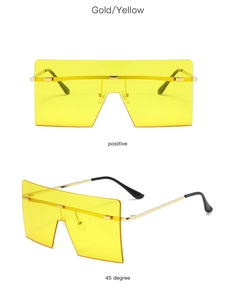 Detailed front and 45-degree view of rimless square gold sunglasses with yellow lenses